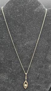lot 165 image: 10K Gold and Diamond Pendant with Sterling Silver Chain 17 Chain