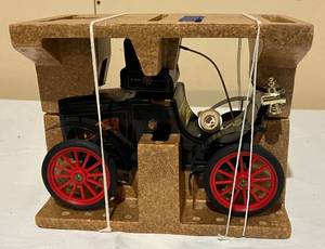 lot 30 image: Vintage Beam Oldsmobile Decanter