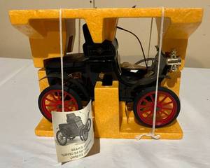lot 31 image: Vintage  Beam 1904 Oldsmobile Curved Dash Decanter
