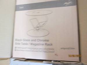 lot 105 image: black glass and chrome side table...