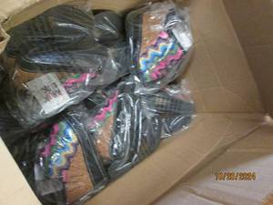 lot 121 image: big case of muk luk shoes...