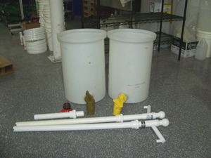 lot 135 image: (2) Large Barrels with Spouts and (2) ULine Drum Pumps
