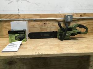lot 20 image: Green Machine Cordless Chainsaw With 2.5 Ah Battery and Charger Model # GMCS6200
