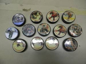 lot 61 image: (13) MINNESOTA WILD COLLECTORS PUCKS - GREAT PIECES - NHL - SEE PICTURES
