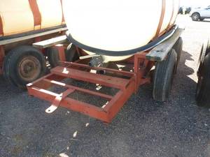 750 gallon poly tank on running gear, with pump and motor