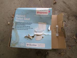 Raised toilet seat in original box...
