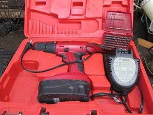 Cordless drill and charger in hards...