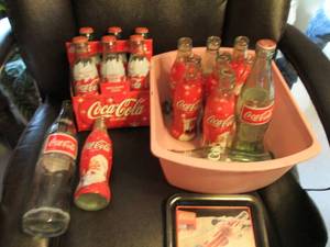 Assortment of glass Coca-Cola bottl...