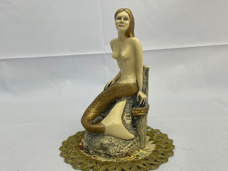 lot 14 image: Golden Mermaid Statue by G.H. Cook Company Fine Art Sculptures. Cultured Ivory. Estimated Value $50-75