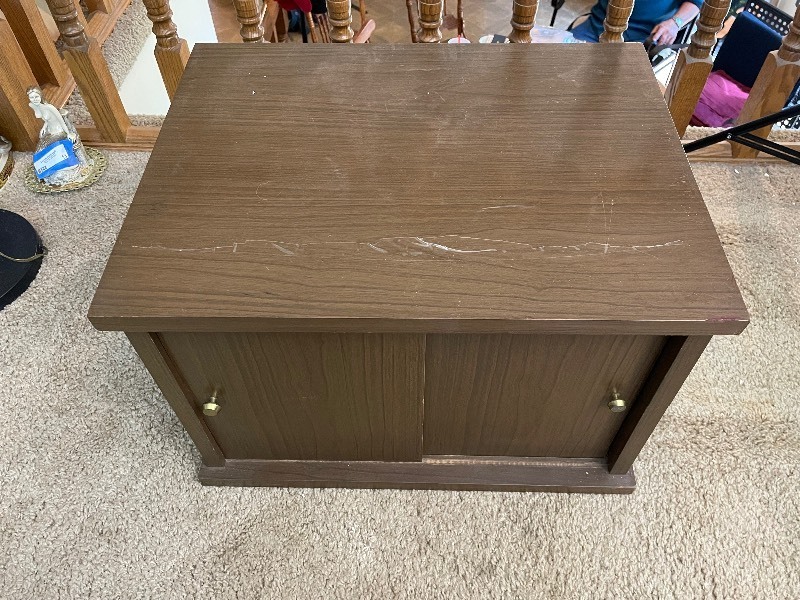 lot 16 image: Mid-Century Modern Cabinet with Sliding Doors. 22 Inches Wide by 17 Inches Deep by 15 Inches High.