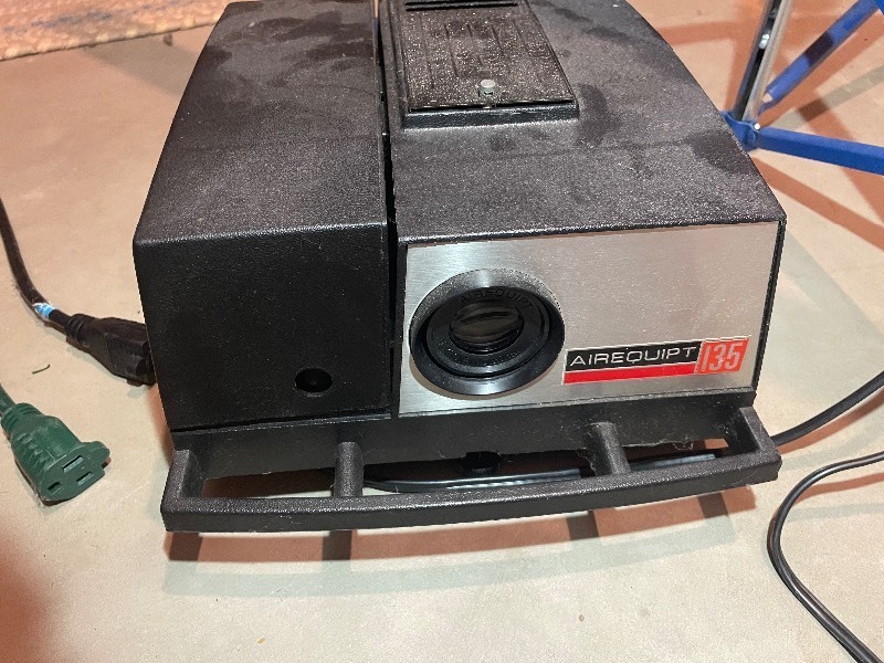lot 470 image: Air Equipped 135 Slide Projector, Slide Display TraysSorter, and Screen.