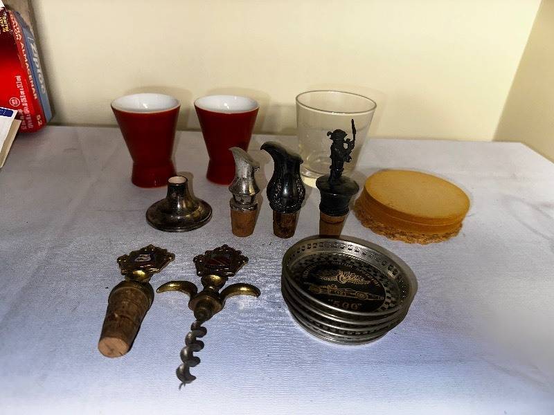 lot 1027 image: Variety Of Vintage Coasters And Bottle Stoppers As Seen In Photo