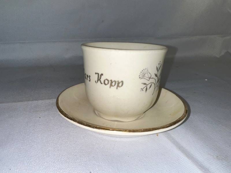 lot 619 image: Vintage Father Cup and Saucer