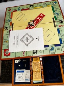 lot 957 image: Wooden Boxed Michael Graves Monopoly Board Game Like New and Dice Game Board
