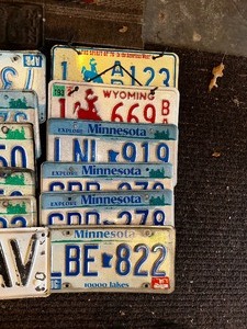 lot 1050 image: Variety of License Plates and Street Sign