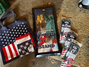 lot 966 image: United We Stand Wall Clock and New US Flag Banners Estimated Value $100