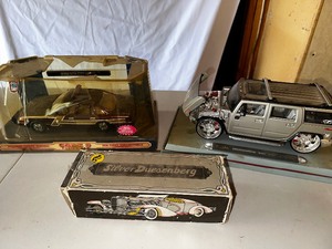 lot 919 image: Three Vintage Cars Maistro Playerz 118 Hummer H2, Avon Silver Duessenberg, and Minnesota State Police Patrol Car Estimated Value $100-150
