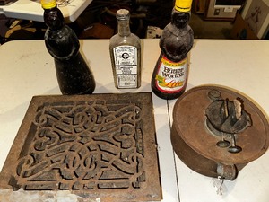 lot 922 image: Vintage Items Mrs Butterworths Syrup Bottles, Kerosene Lamp Base and Metal Antique Floor Vent