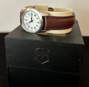 lot 44 image: Brand New in Box  Victorinox White Face and Brown Leather Straps for Women