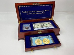 lot 3 image: The First Enhanced Uncirculated Dollar from the San Francisco Mint in a Cherrywood Box.