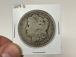 lot 21 image: 1889-O Morgan Silver Dollar