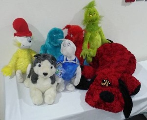 lot 794 image: Dr. Suess Stuffies and More. Grinch, Clifford, Yertle, Sam I Am and More.