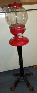 lot 140 image: Vintage Carousel Antique Gumball Machine on Cast Iron Stand