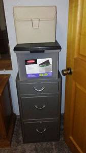 lot 283 image: 3-drawer filing cabinet and a large Rubbermaid storage bin.