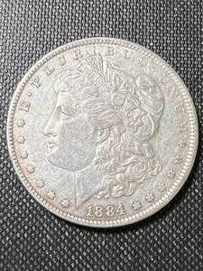 lot 23 image: 1884-O US MORGAN SILVER DOLLAR