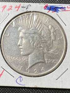 lot 24 image: 1924 US PEACE SILVER DOLLAR