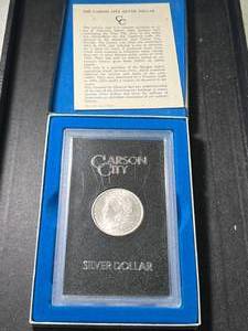 lot 87 image: 1882-CC US MORGAN SILVER DOLLAR IN GSA BOX