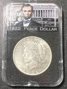 lot 04A image: 1922 PEACE SILVER DOLLAR IN ABE LINCOLN SLAB