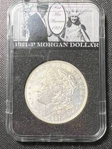 lot 09A image: 1921 US MORGAN SILVER DOLLAR IN MISS AMERICA SLAB