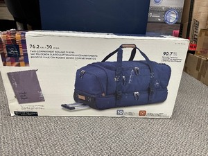 lot 71 image: Delsey Large Expandable Duffle Bag Luggage with Hard Bottom  Wheels