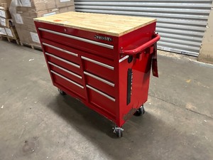 lot 16 image: Husky 42 in. W x 18.1 in. D 8-Drawer Red Mobile Workbench Cabinet with Solid Wood Top - Some Rust Along Bottom See Pictures