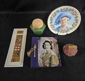 lot 49 image: Collection of Commemorative Queen Elizabeth II Items - Plate, Book, Jars, and Marker