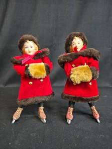 lot 56 image: Pair of Vintage Skating Dolls in Red Velvet Coats