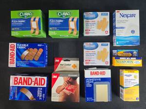 lot 92 image: Lot of 10 First Aid Bandages and Ointments - Variety Pack quantities unverified