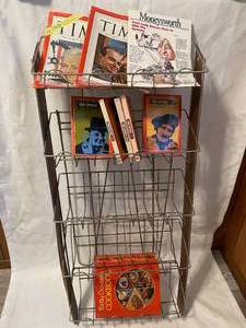 lot 176 image: Free standing magazine rack with vi...