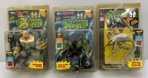 lot 143 image: Todd Toys Misc. SPAWN Action Figures With Comic (NIB) Packaging Beat Up A Little & Yellowing In Plastic Present, 1 Loose Head On Figure
