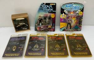 lot 176 image: Misc. Star Trek Action Figures & More (NIB) Packaging Beat Up A Little Some Packaging Yellowed