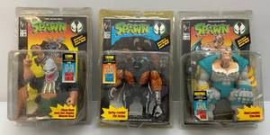 lot 147 image: Todd Toys Misc. SPAWN Action Figures With Comic (NIB) Packaging Beat Up A Little 1 Loose Piece In Sealed Packaging