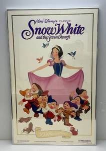 lot 206 image: 1937 Walt Disneys Classic (Snow White) Movie Poster (Has Fold Marks) Framed Behind Glass With Brushed Aluminum Frame 25 x 39 14