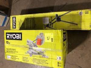 lot 14 image: RYOBI 15 Amp 10 in. Corded Sliding Compound Miter Saw and Universal Miter Saw QUICKSTAND Customer Returns See Pictures