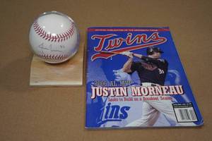 lot 11 image: Signed Justin Morneau Baseball and 2006 Twins Magazine