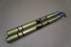 lot 89 image: Bruce Lee 12.5 Gold Nunchucks