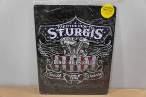 lot 206 image: Metal Sturgis Sign