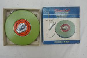 lot 13 image: Vintage Komelon measuring tape