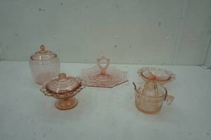 lot 109 image: Pink Depression Glass juicer, relish tray, dessert tray, candy dish