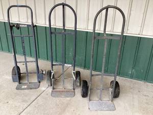 lot 131 image: Lot of 3 Pneumatic-Tired Hand Trucks  Sturdy and Functional